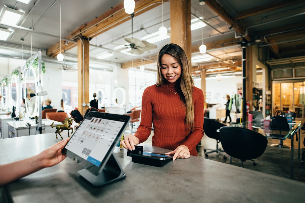 Local Singapore business owner serving a customer at the counter