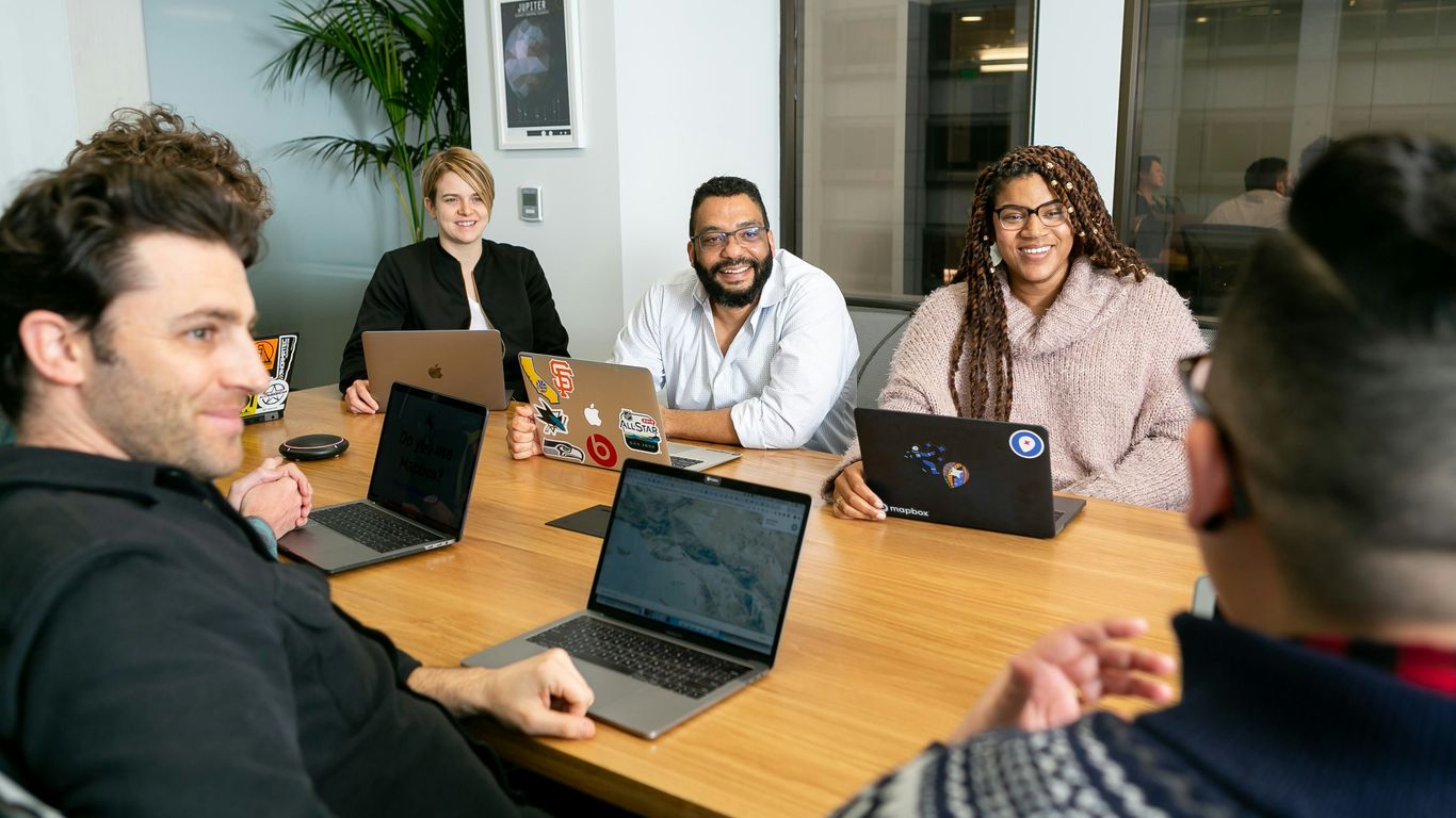 A diverse team collaborates on marketing strategies.