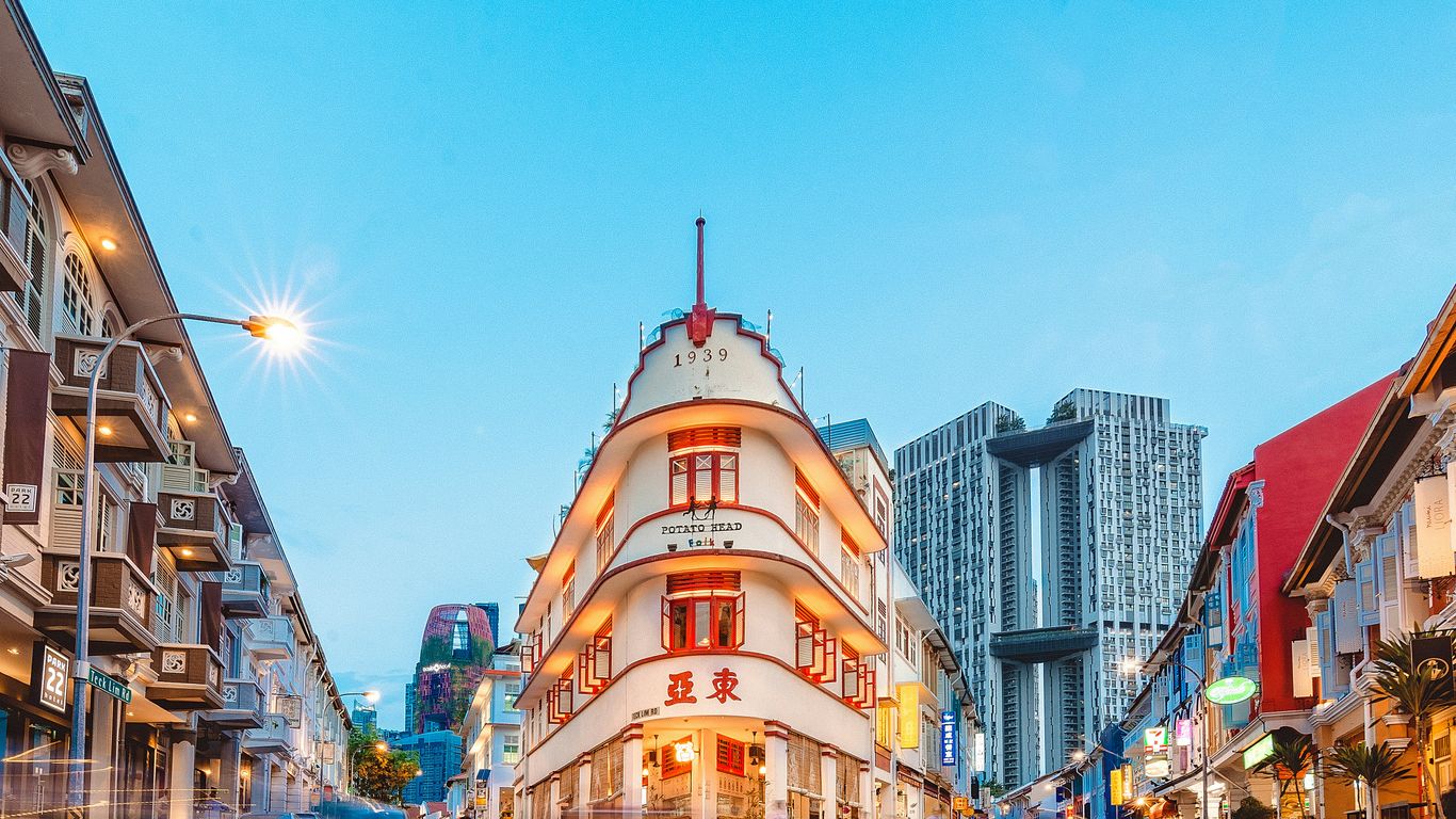 A vibrant city street in Singapore with local shopfronts